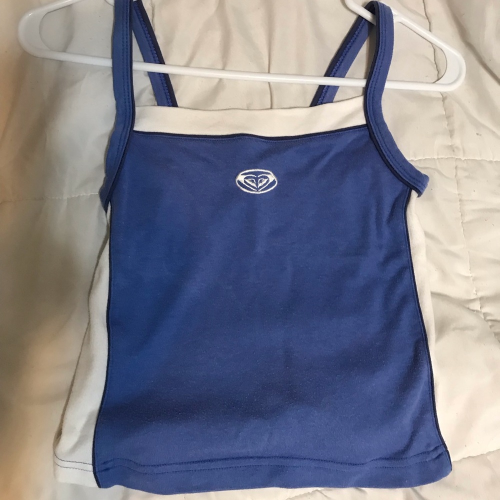 Vintage periwinkle blue Roxy tank with white stripes down sides.